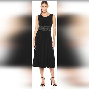 Jessica Howard Elegant Black Midi Dress with Accent.